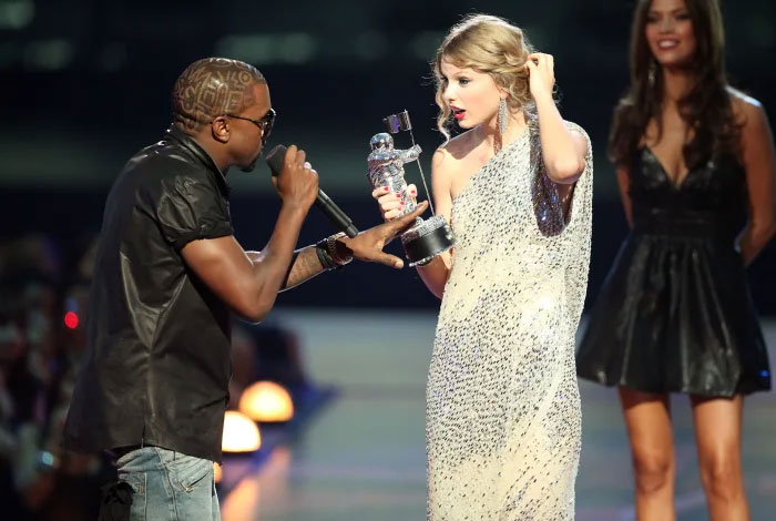 Taylor Swift Has A Framed Picture Of Kanye West Interrupting Her At The 2009 MTV Video Music Awards In Her Living Room. It's Captioned, "Life Is Full Of Little Interruptions"