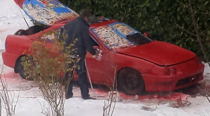Neighbor Is Painting His Red Car Red In The Snow. Some Masking But Not On The Wheels/Tires, Plus The Windows Are Open. It's Forecast To Rain All Day Tomorrow
