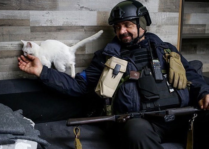 Woman Carries And Comforts Cat Amid Air Raid Sirens Sounding In Kyiv, Ukraine Woman Carries And Comforts Cat Amid Air Raid Sirens Sounding In Kyiv, Ukraine