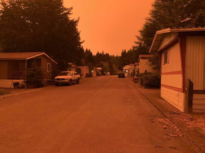 Wildfires Hundreds Of Miles Away Turn The Sky Red And Bring Ash Falling Like Snow