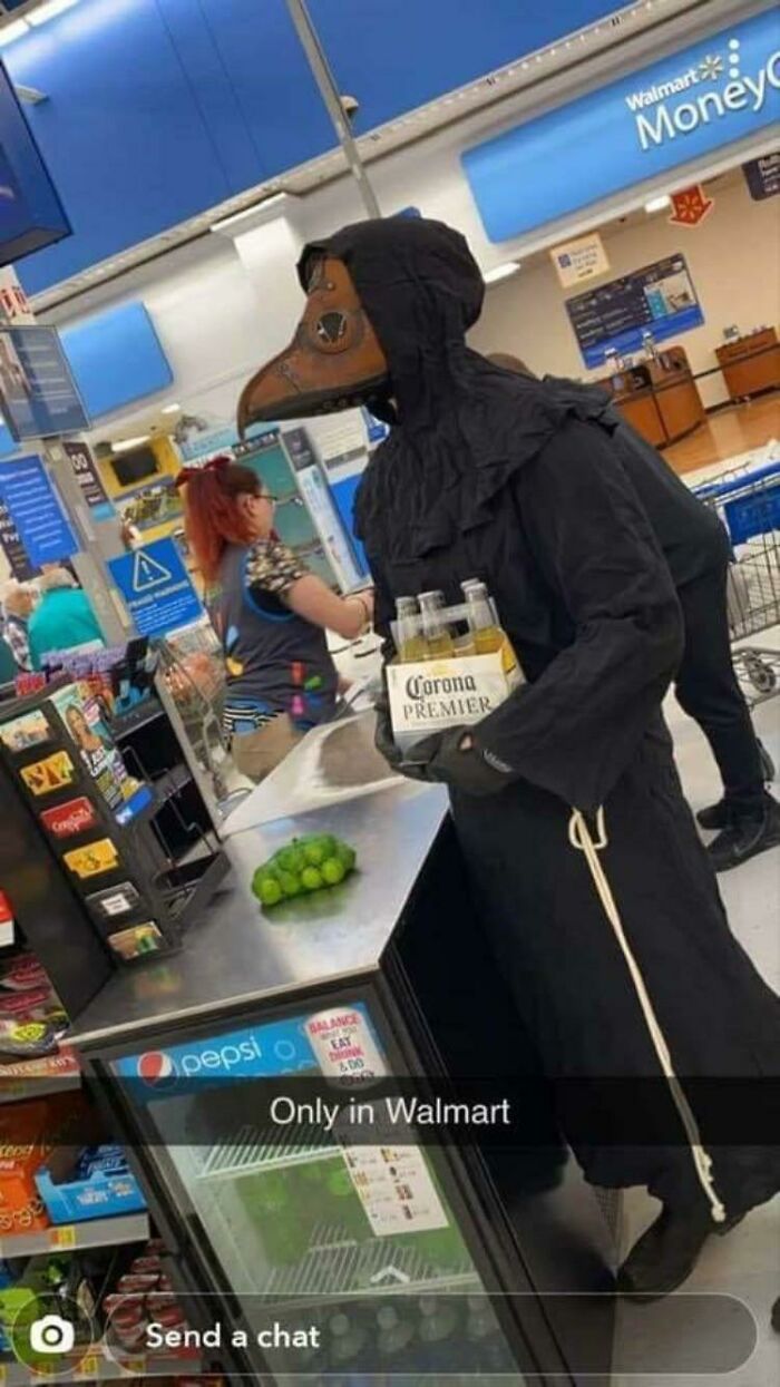 Person wearing a creepy costume in a cash register 