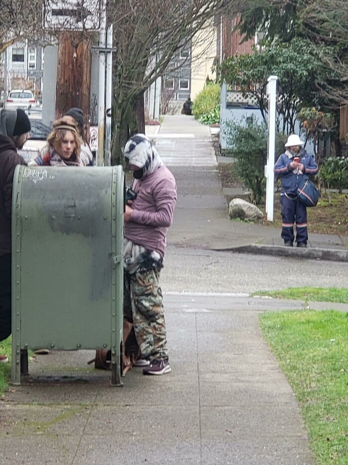 Trying To Drill Open A Mailbox In Front Of A Mailman