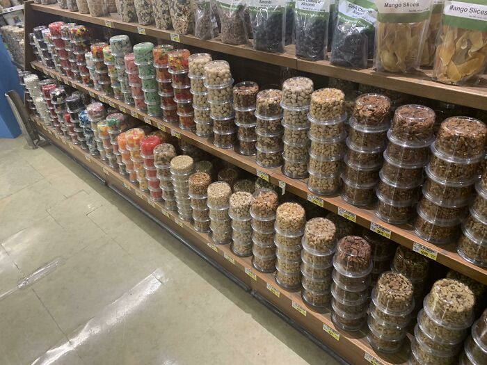 This Grocery Store Displays These Nuts And Other Snacks Upside Down So You Can See The Contents More Clearly