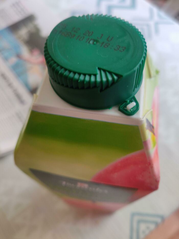 The Cap Of This Apple Juice Bottle Has An Engraved Arrow, Which Indicates The Direction Of Rotation To Open It