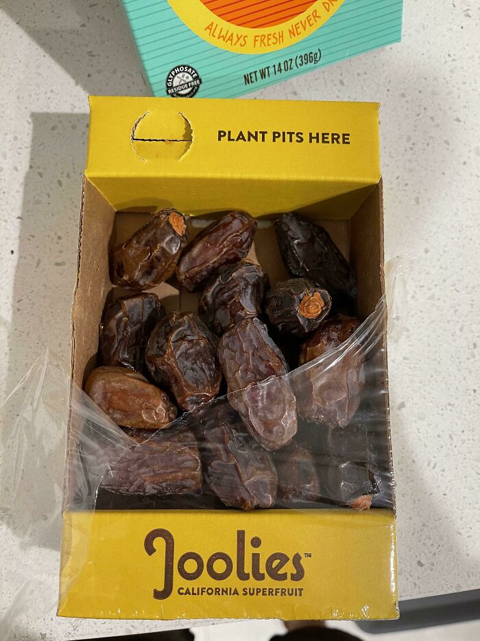 This Box Of Dates Comes With A Built In Area To Throw Away The Pits