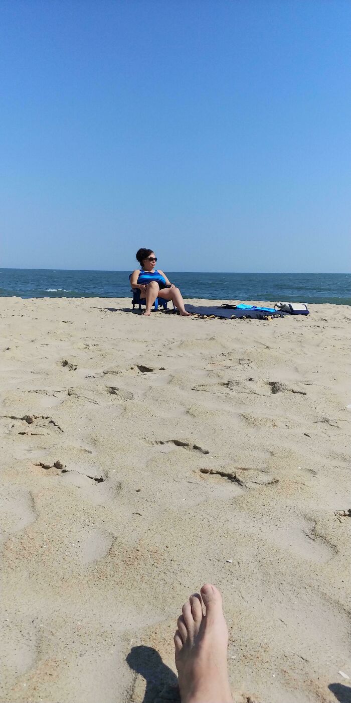 This Time Of Year The Beach Is Almost Empty. To The Right And To The Left Of Us Is Available. This Lady Walks Around Us And Plops Herself Down Taking Away Our Unobstructed View Of The Ocean