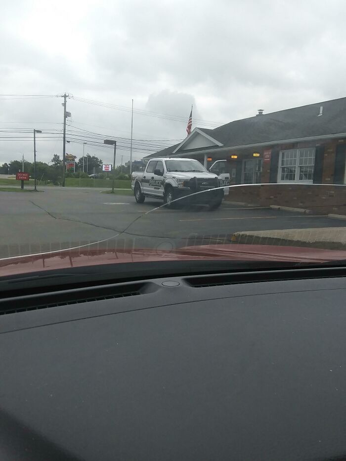Cop Parks Like This Every Week. He's Parked Across 3 Spots, One Of Them Handicapped, And He's Inside The Bank With His Driver Door Open