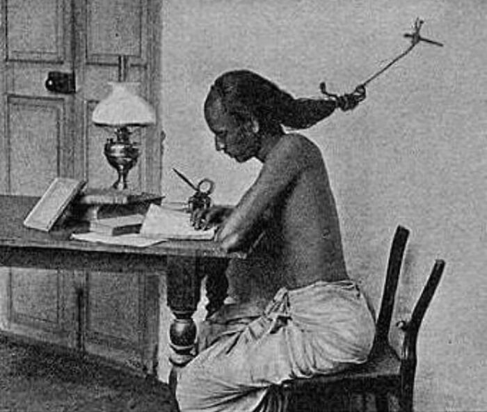 An Indian Student Studying At The University Of Madras In Tamil Nadu, 1905. While Studying Late At Night, Students Use To Tie Their Hairs To A Nail In The Wall To Prevent Themselves From Falling Asleep