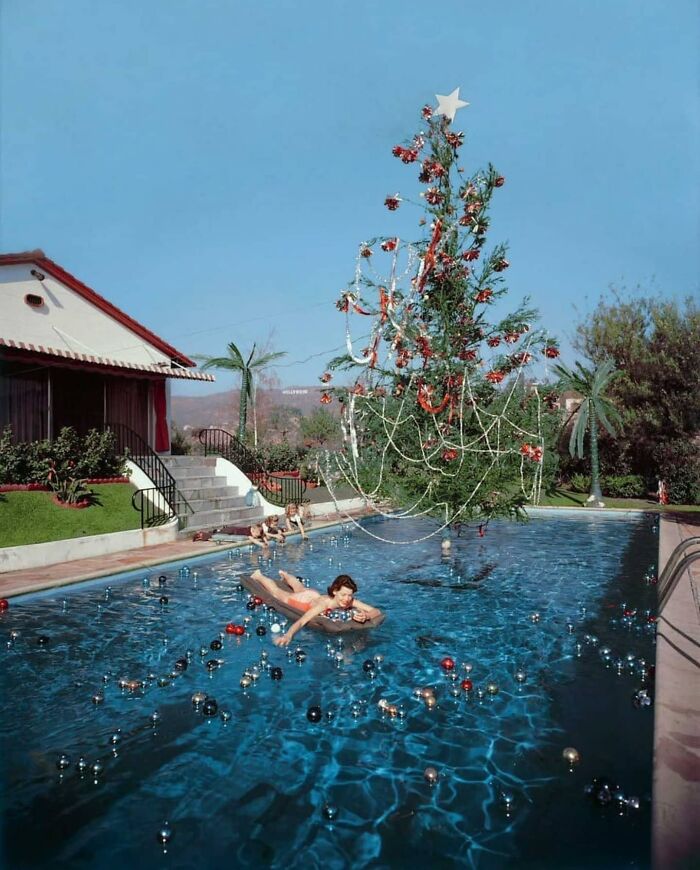 Swimming In A Pool With A Christmas Tree & Floating Ornaments In Los Angeles, 1955