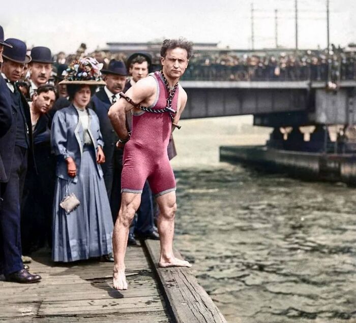Escape Artist Harry Houdini Locked Up In Chains About To Take A 30 Foot Plunge Off The Harvard Bridge Into The Charles River In Boston, 1908 