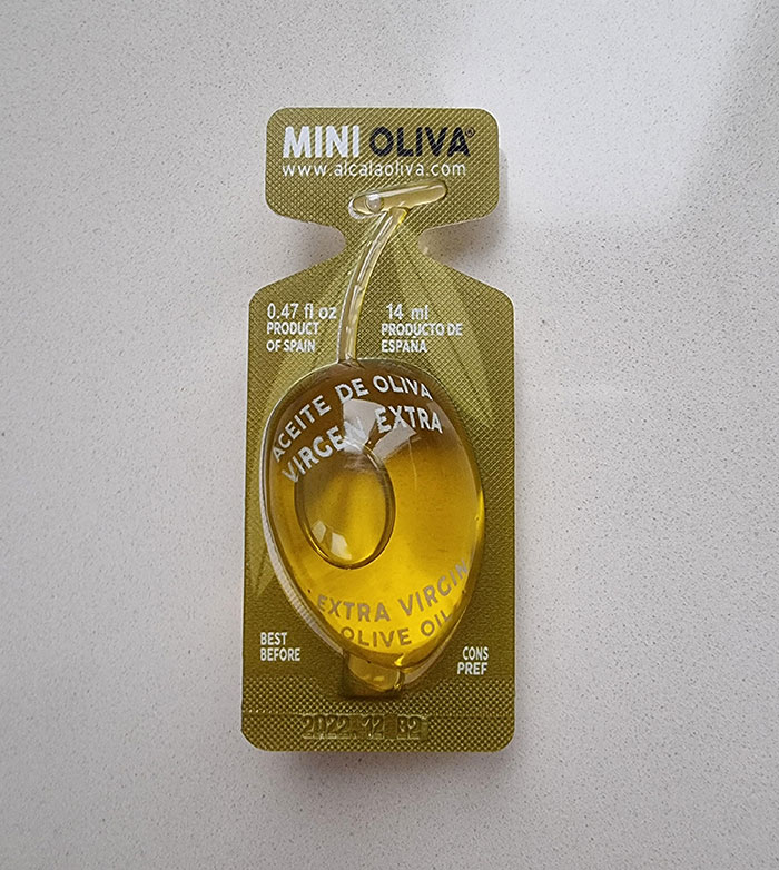 A Packet Of Olive Oil Shaped Like An Olive