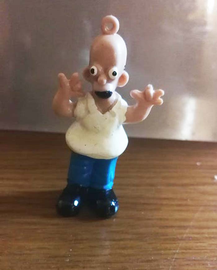 This Weird Chinese Bootleg Is Homer Simpson. I Don't Even Know Where I Got It Or How Long I've Had It, But I Don't Think It Was Legally Manufactured