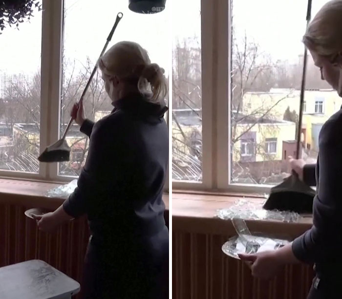 Una residente de Kiev canta con lágrimas en los ojos el himno nacional de Ucrania mientras limpia los cristales rotos de su apartamento