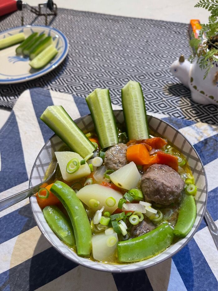 My Wife’s Clear Meatball Soup Garnished With Cucumber, Shallots & Sugar Snap Peas.