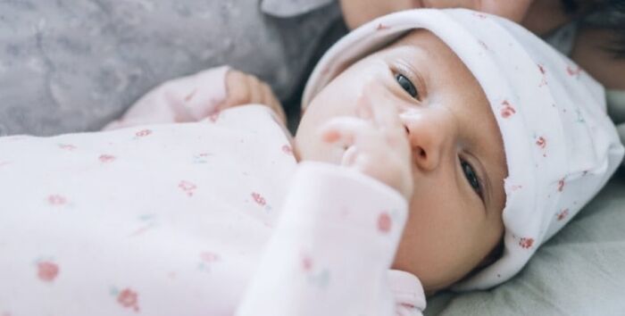 Not This Real Baby, But A Swaddled Toy Preemie That Squirmed Slowly When You Pulled The String.