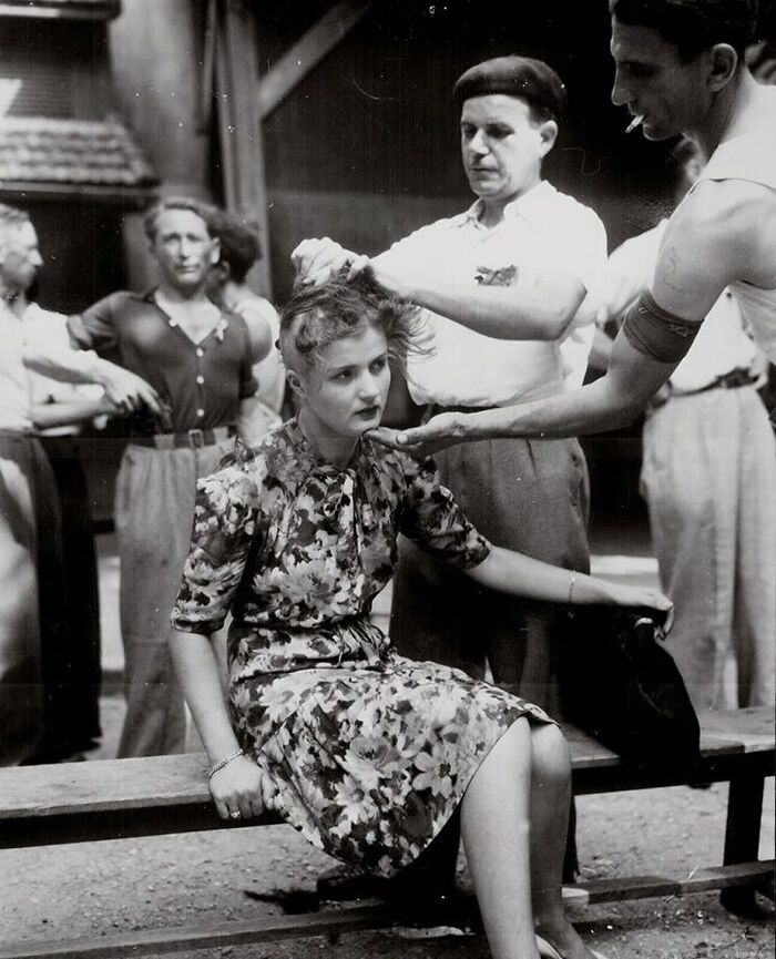 A French Woman Who Befriended And Formed Relations With Nazis, Is Having Her Head Shaved By French Civilians, As To Publicly Mark And Shame Her | Montelimar, France, 29 August 1944.