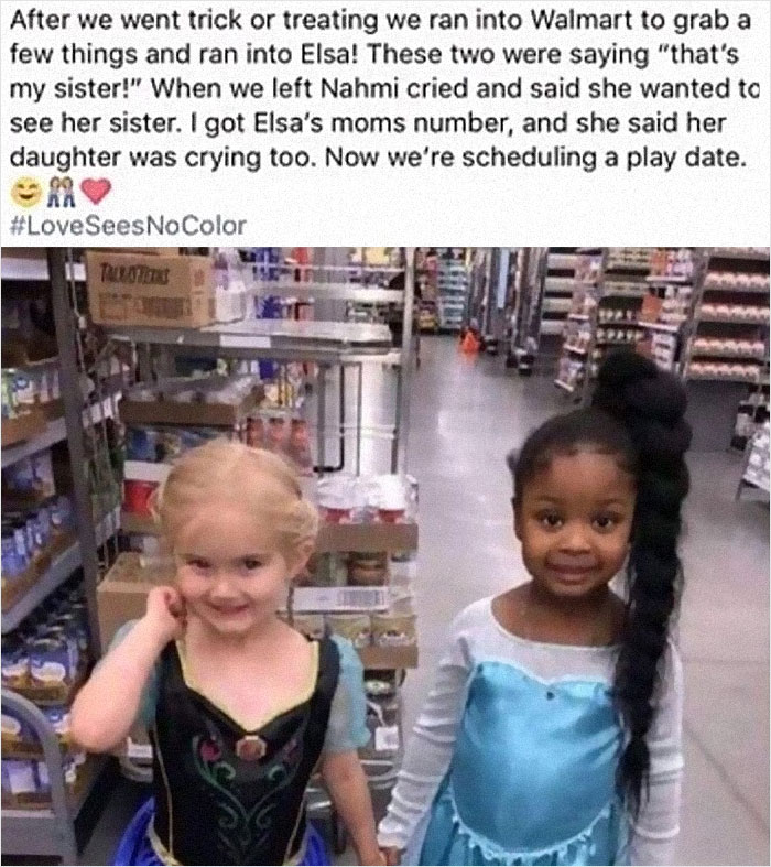 Two girls hold hands in Walmart 