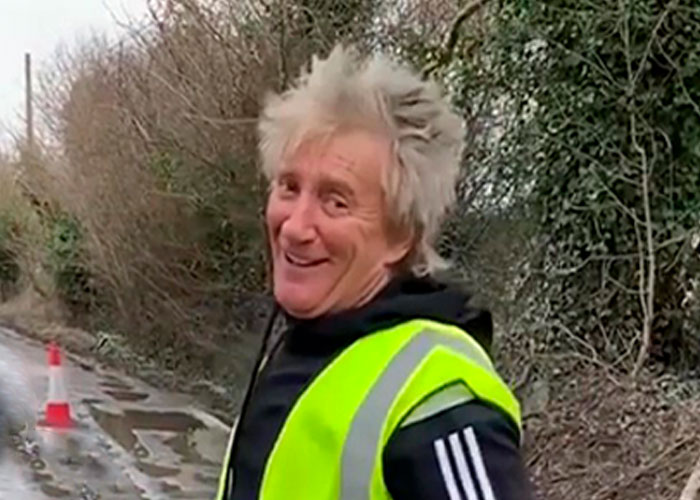 “My Ferrari Can’t Go Through,” Jokes Sir Rod Stewart Whilst Filling In Potholes Near His Essex Home