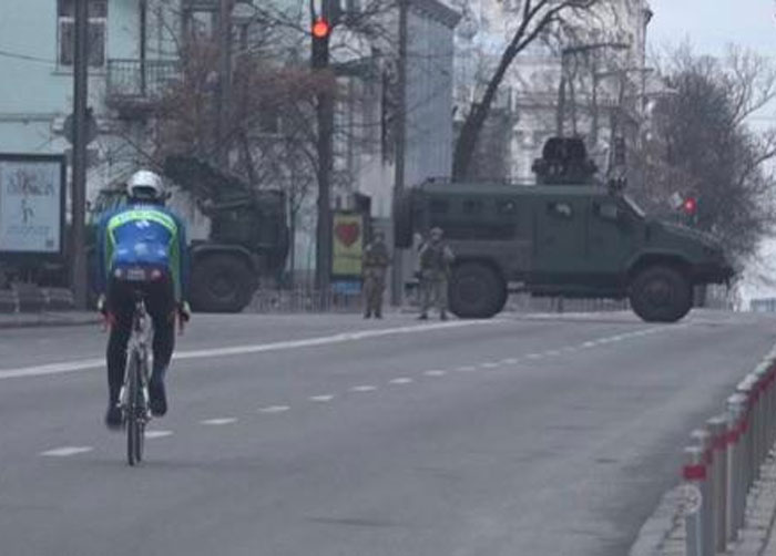 In Kiev A Guy Just Kept Is Normal Routine And Went For A Bike Ride Surrounded By Tanks
