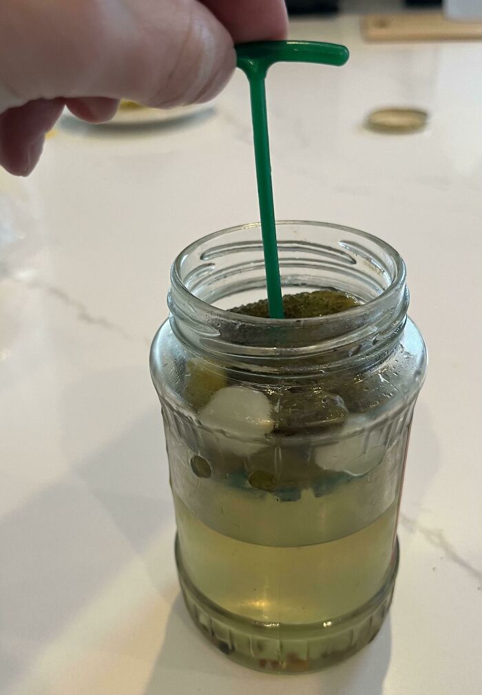 This Pickle Jar Has A Little Handle Attached To A Basket That Makes The Pickles Easier To Retrieve