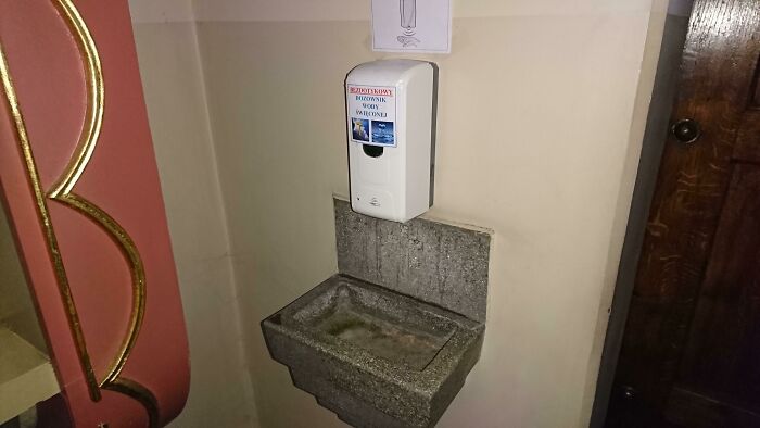 A Touch-Free Holy Water Dispenser Inside A Church In Poland