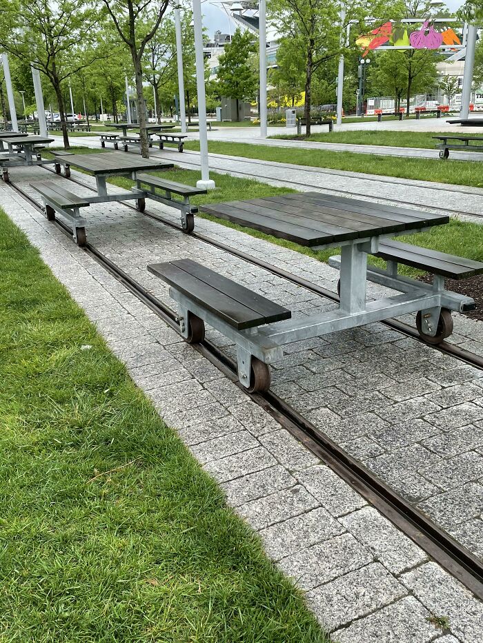 These Tables Are On Railroad Tracks For Easy Moving