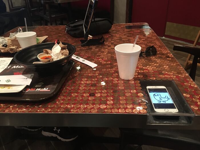 This Restaurant Has Receptacles In The Table So You Won't Spill On Your Phone