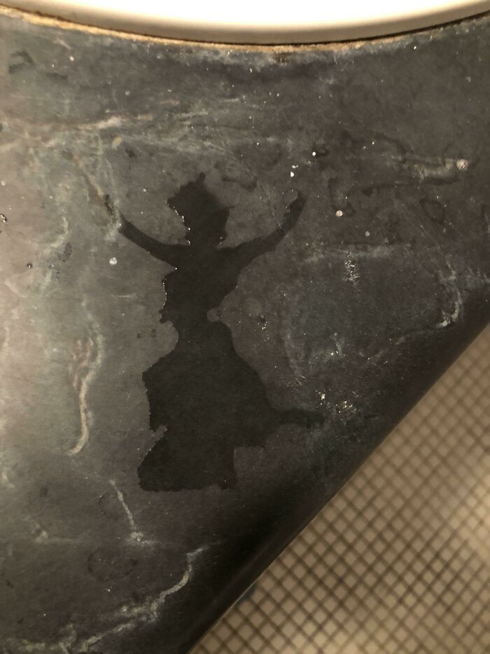 This Water Spill On My Sink Looks Like A Dancing Lady In A Dress And Top Hat