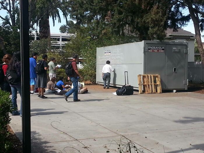 Professor Won't Let Fire Alarm Stop Students From Learning, Proceeds To Teach Using Storage Container