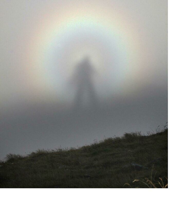 A Rare Optic Sight, The "Brocken Spectre," Which Occurs When A Person Stands At A Higher Altitude In The Mountains And Sees His Shadow Cast On A Cloud At A Lower Altitude