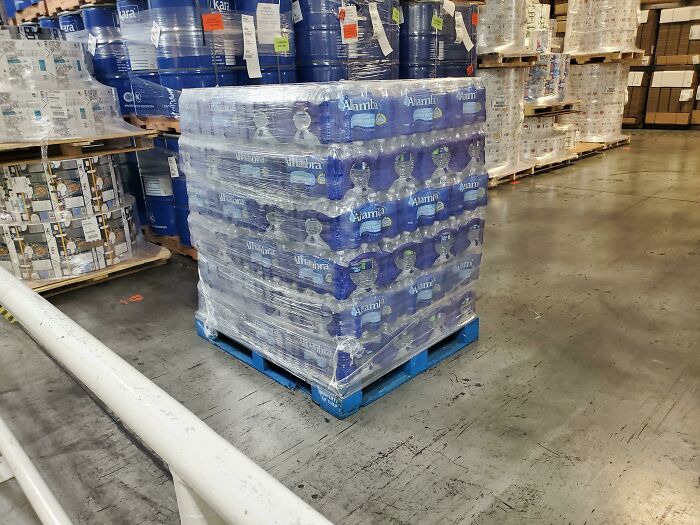  Our Boss Bought A Pallet Of Water To Give A Case To Each Employee At Work Due To A Shortage In Stores. She Is Working On Getting Us Toilet Paper Too