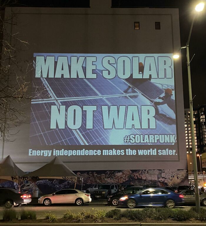 “Make Solar Not War,” Projected In Oakland.