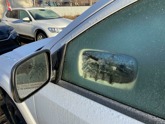 The Sun Reflecting Off My Side Mirror Melted A Mirror-Shaped Hole In The Frost On The Window