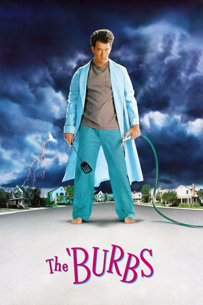 Man in pajamas and robe holding a spatula and garden hose against a stormy sky, representing dark comedy movies.