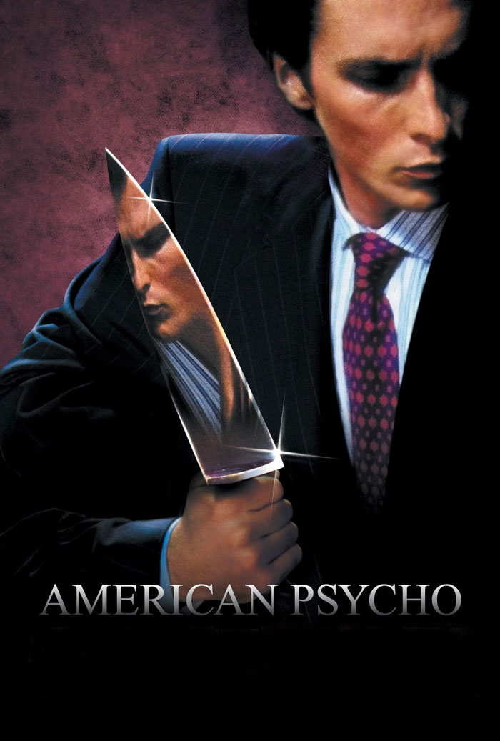 Man in suit holding a large knife with his reflection, representing dark comedy movies with a twisted laugh theme.