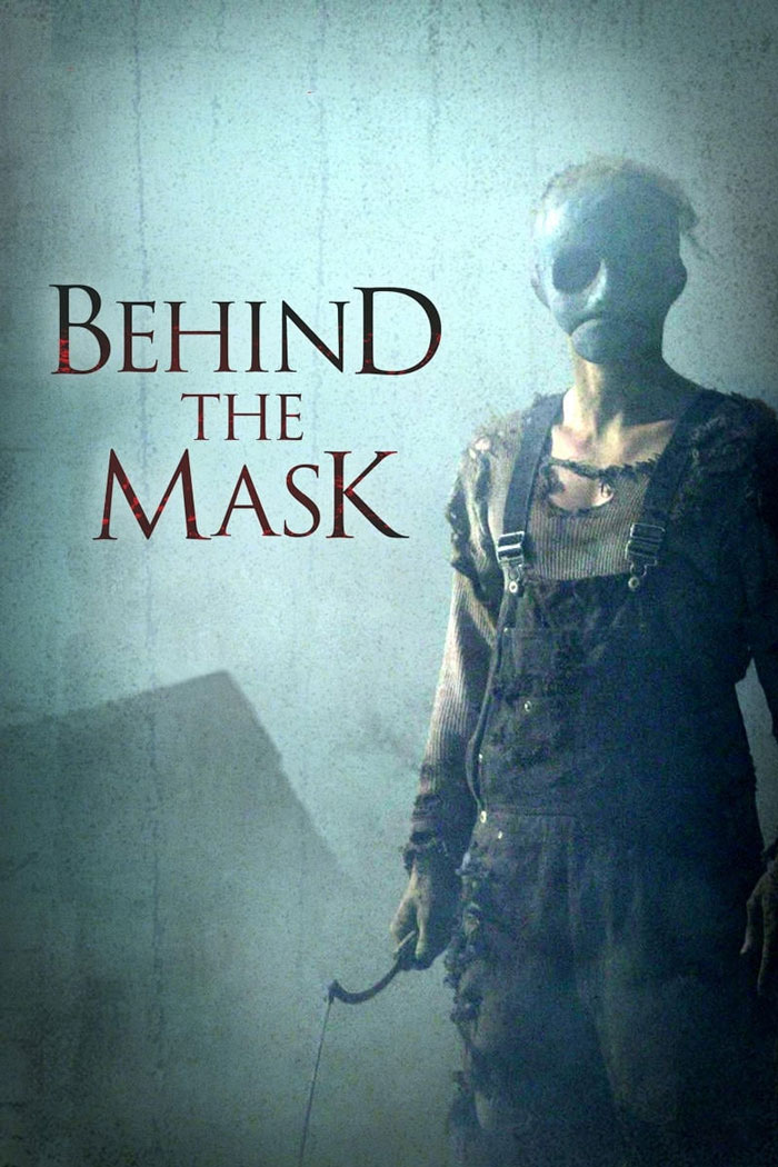 Creepy figure wearing a mask and worn clothes in a dark, eerie setting for dark comedy movies.