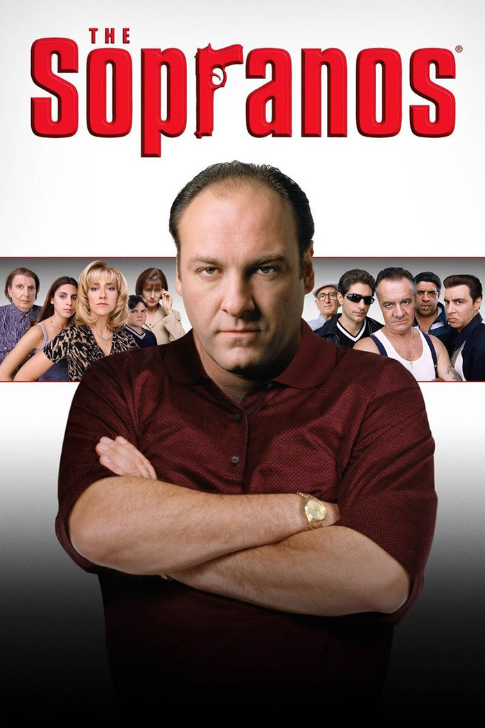 "The Sopranos TV show cast, featuring a man in a maroon shirt with supporting characters in the background."