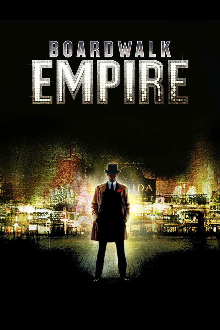 Boardwalk Empire poster featuring a man in a suit and hat against a glowing city backdrop.