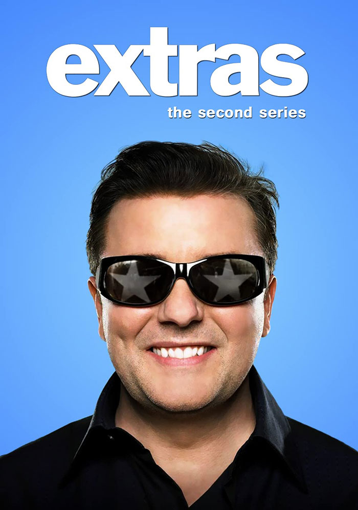 "Extras season two cover image with a smiling individual wearing sunglasses against a blue background, showcasing top HBO show."