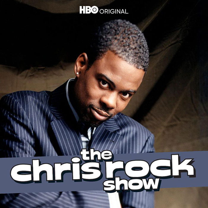 Chris Rock in a suit on "The Chris Rock Show," a popular HBO TV show.