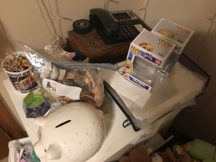 An Old Office Phone, My Pop Doll Boxes, A Mug With Tiny Cocktail Umbrellas, A Bag Of Shells And A Piggy Bank My Grandma Gave Me