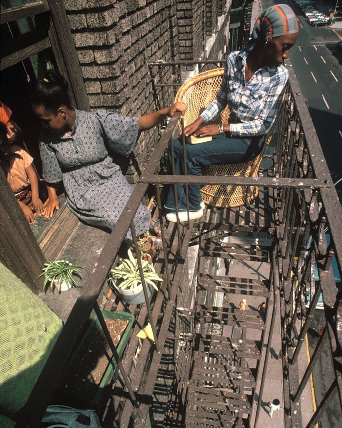 Two Women Sitting Outside On The Fire Escape In Harlem, NYC, 1978