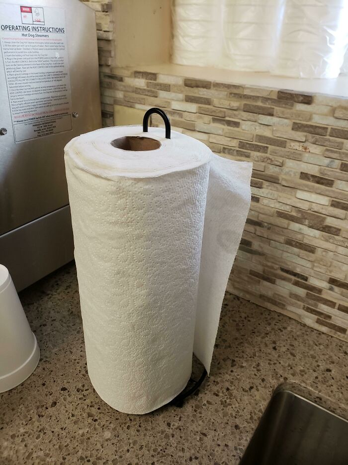 Coworkers Replacing The Paper Towel Roll