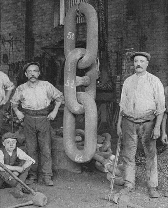 Forge Workers Beside Part Of The Titanic's Anchor Chain