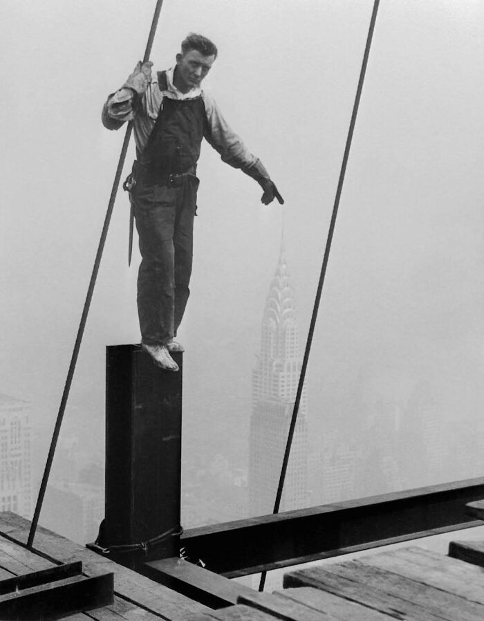 Steelworker Touching The Tip Of The Chrysler Building During The Construction Of The Empire State Building, 1931