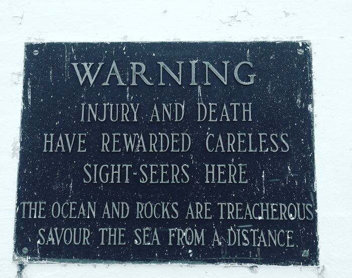 Warning Sign Near Peggy's Cove Lighthouse. Nova Scotia, Canada.