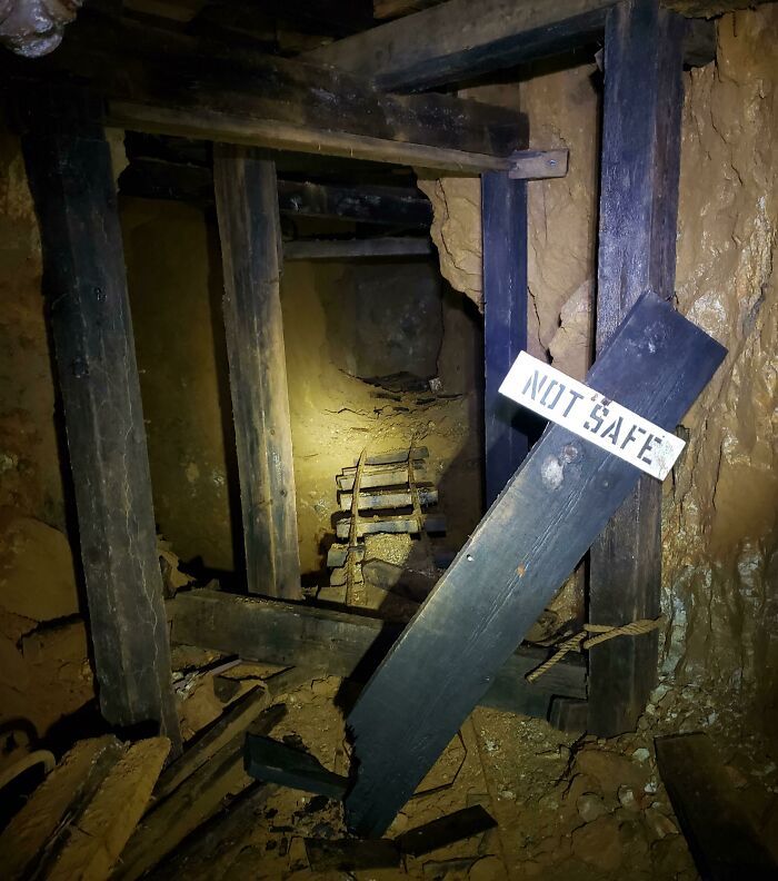 I Explored An Abandoned Mine This Weekend. The Floor Drops Down Into An Abyss Past This Sign.