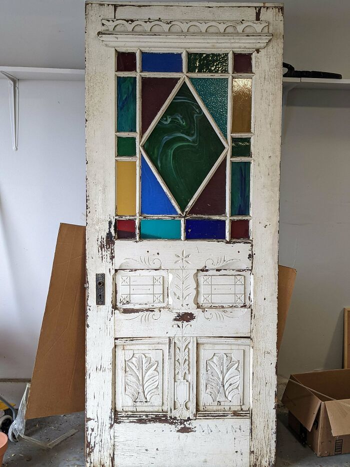 I Saw Someone Throw An Old Door Mostly Covered In Cardboard Into The Landfill Pit. I Spotted A Bit Of Colored Glass Poking Out From Under The Cardboard So I Rescued It. Couldn't Be More Excited After The Reveal. Anyone Have Any Insight?