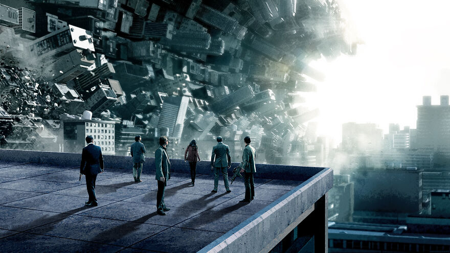 Six characters from ‘Inception’ on the roof and cityscape folding into a cylinder in front of them