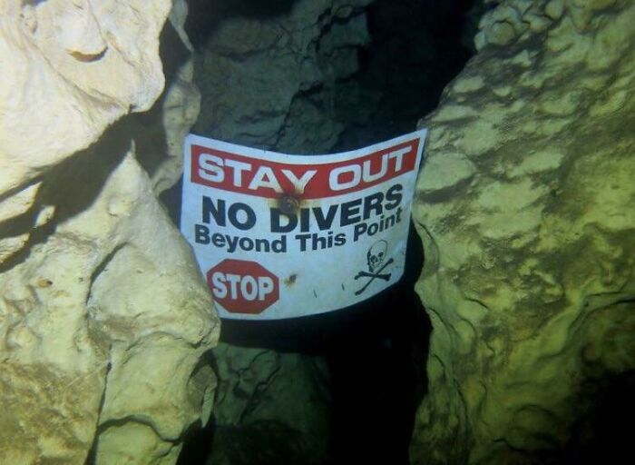A Warning Sign For Scuba Divers Deep Underwater
